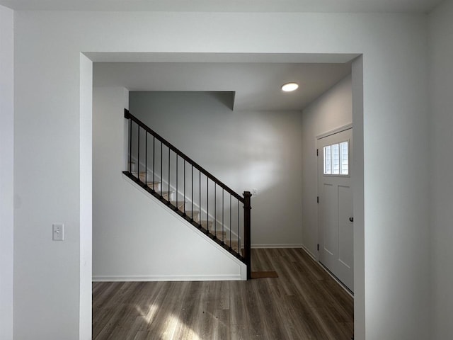 entryway with dark wood-type flooring