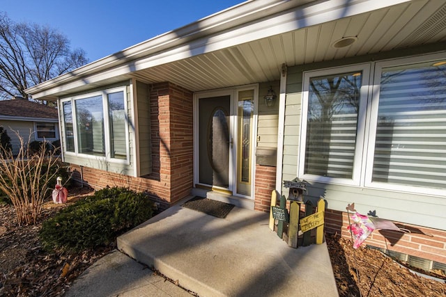 property entrance featuring a patio