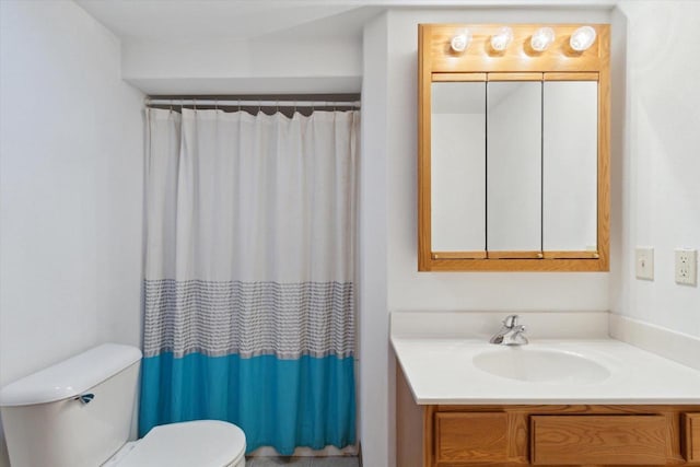 bathroom with vanity, a shower with curtain, and toilet