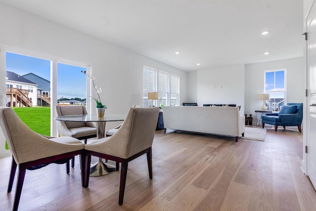 dining space featuring light wood-type flooring