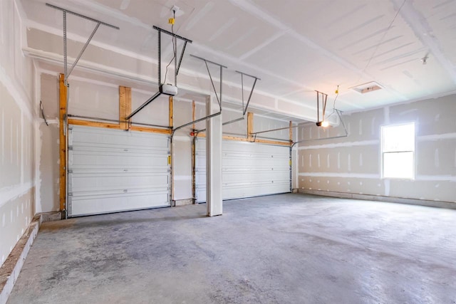 garage featuring a garage door opener