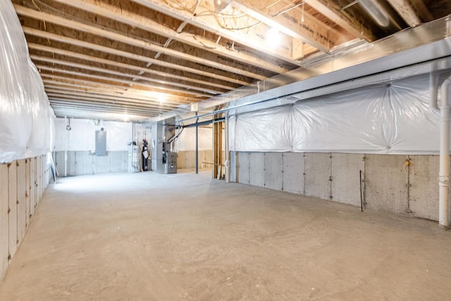 basement with heating unit and electric panel