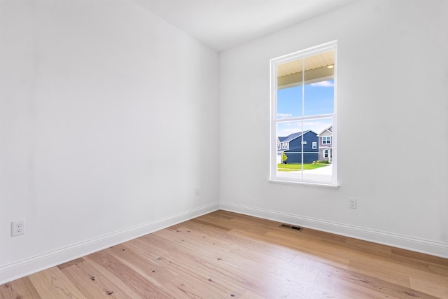 spare room featuring hardwood / wood-style floors