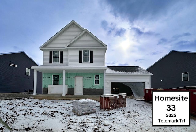 front of property with a garage and a porch