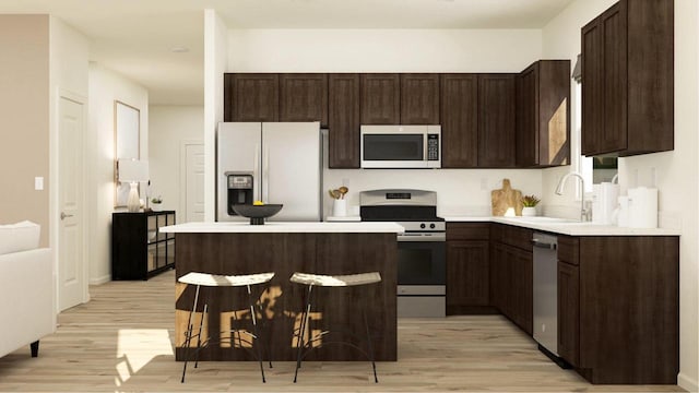 kitchen with sink, light hardwood / wood-style floors, dark brown cabinets, and appliances with stainless steel finishes