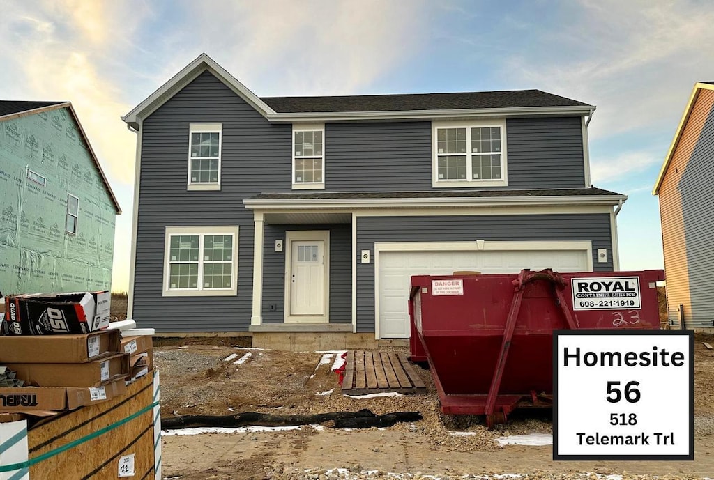 front facade with a garage