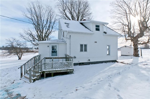 view of snow covered house