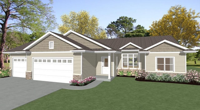 view of front of home featuring a front yard and a garage