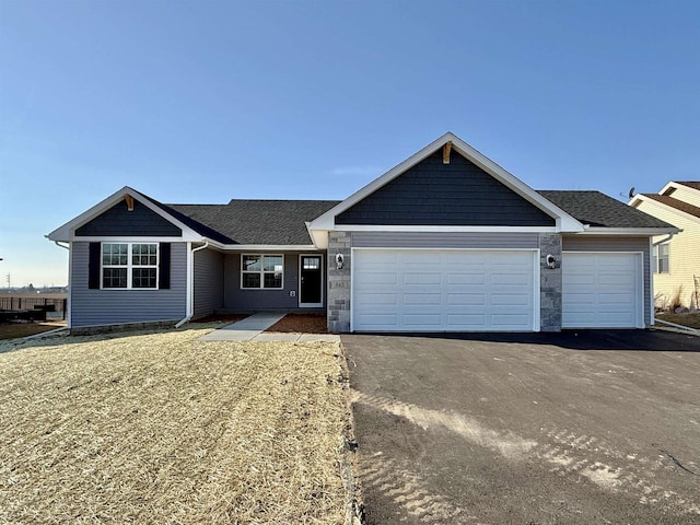 ranch-style home featuring a garage