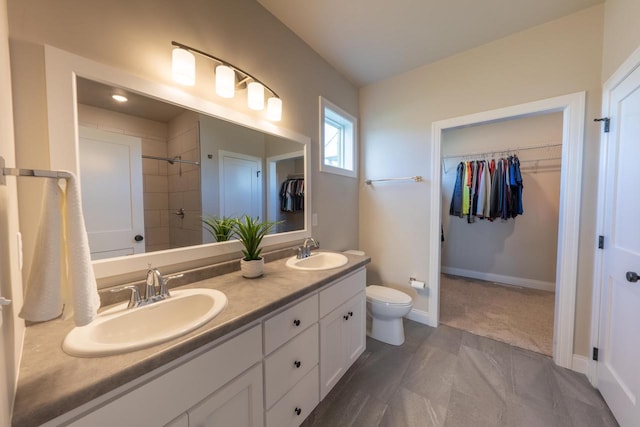 bathroom with toilet and vanity