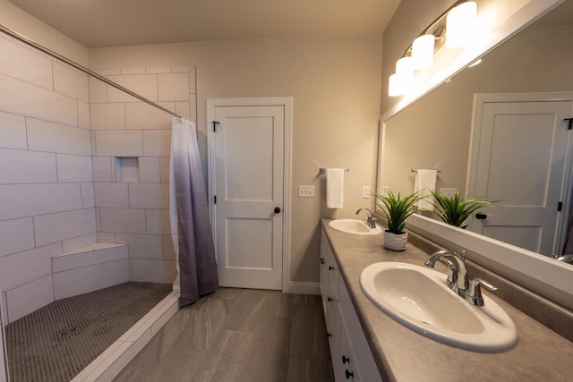 bathroom featuring a shower with shower curtain and vanity