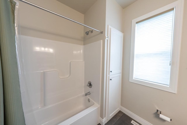 bathroom featuring shower / tub combo and tile patterned floors