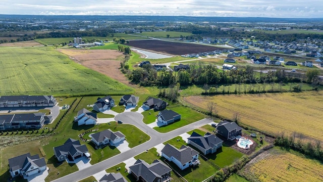 birds eye view of property with a rural view