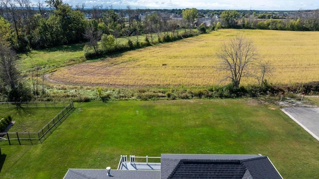 birds eye view of property with a rural view