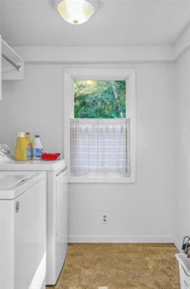 clothes washing area with independent washer and dryer