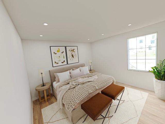 bedroom with light hardwood / wood-style floors