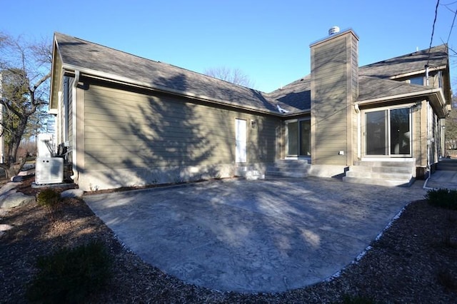 rear view of house featuring a patio