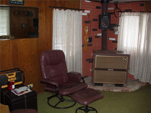 88270 County Highway F, Butternut, WI 54514 - sitting room with wooden walls and a wood stove