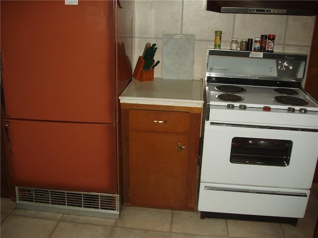 88270 County Highway F, Butternut, WI 54514 - kitchen featuring fridge, electric range, light tile patterned floors, and ventilation hood