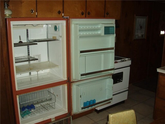 88270 County Highway F, Butternut, WI 54514 - kitchen with fridge, white gas stove, and tile patterned floors