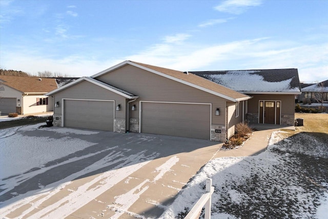 ranch-style home featuring a garage