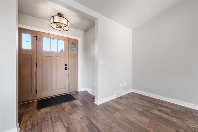 foyer entrance with dark wood-type flooring