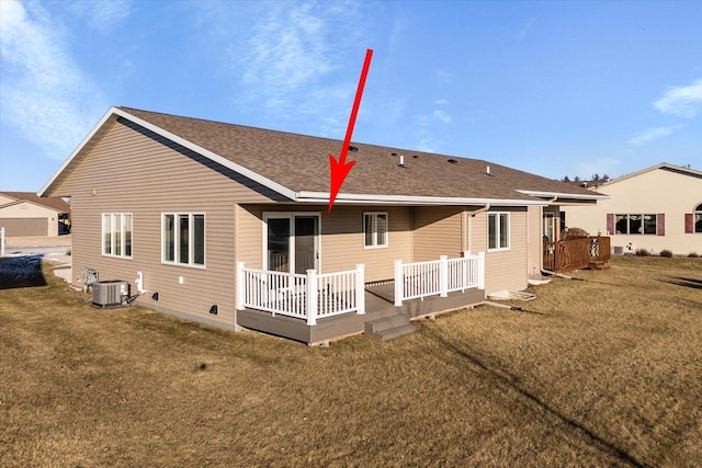 back of house featuring a yard, a wooden deck, and cooling unit