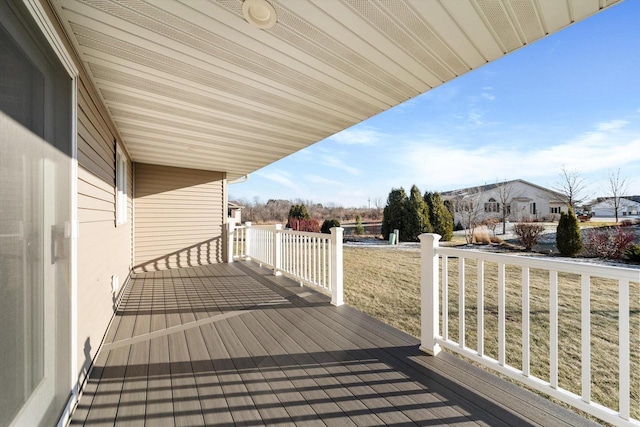 wooden deck with a lawn