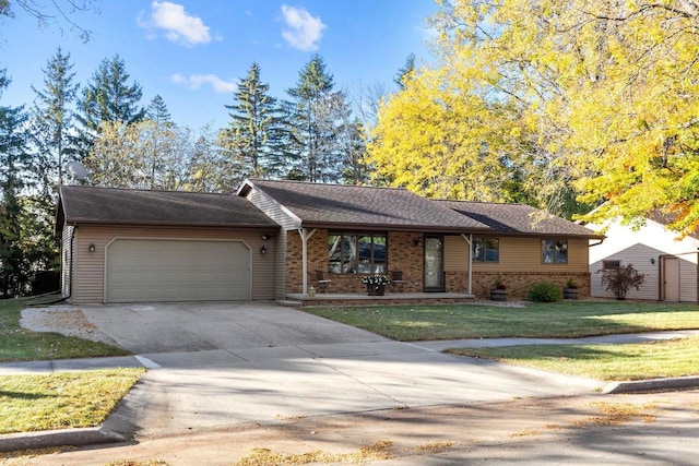 single story home featuring a front lawn and a garage