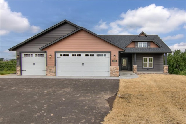 craftsman-style home with a garage