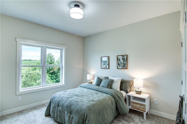 bedroom featuring light carpet