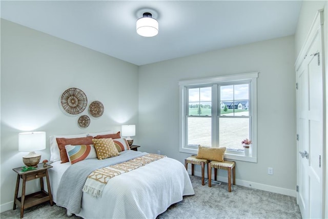 bedroom with light colored carpet