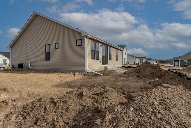 view of property exterior with central AC