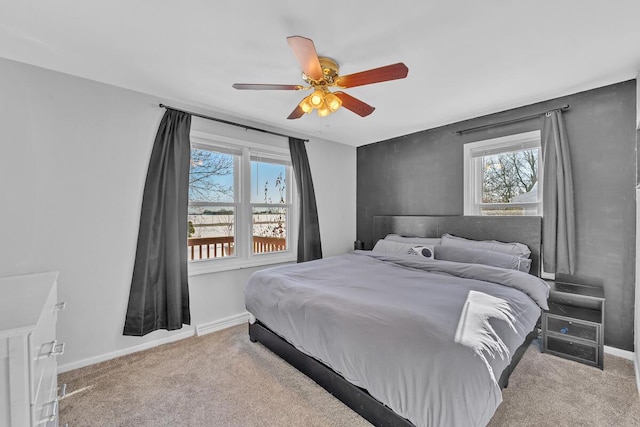 bedroom with light colored carpet and ceiling fan