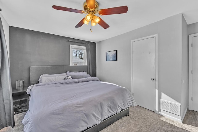 carpeted bedroom with ceiling fan