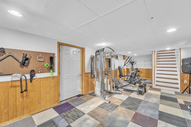 exercise room featuring wooden walls