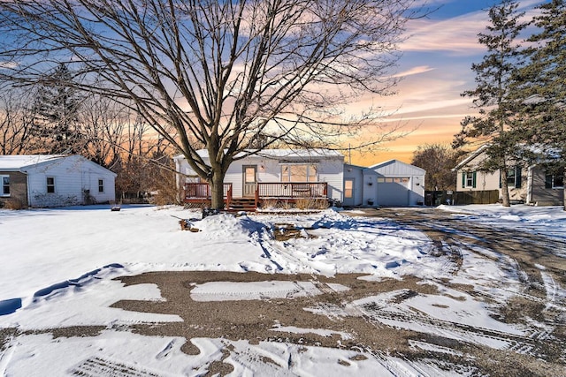 snowy yard with a deck