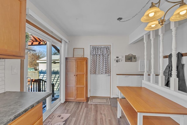 mudroom with light hardwood / wood-style flooring