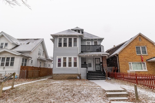 view of front of home featuring a balcony