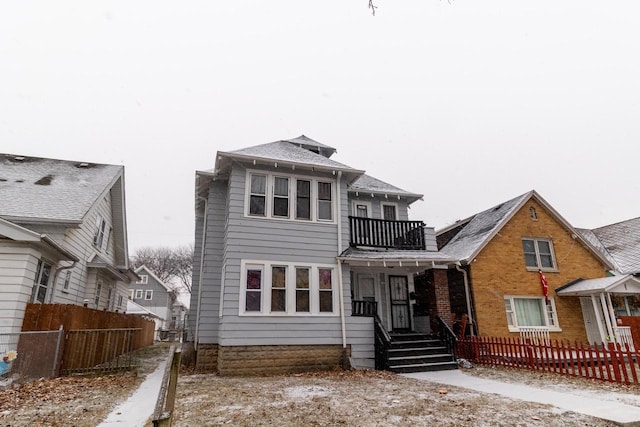 rear view of house featuring a balcony