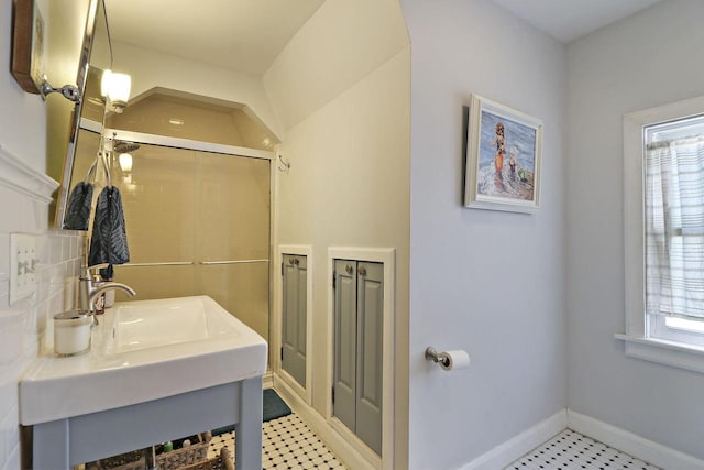 bathroom featuring sink and a wealth of natural light