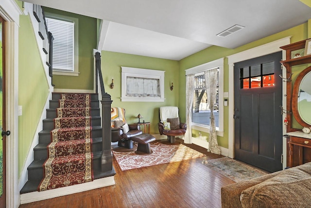 foyer with a wealth of natural light and hardwood / wood-style floors