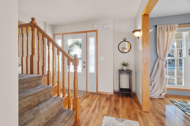 entryway with wood-type flooring