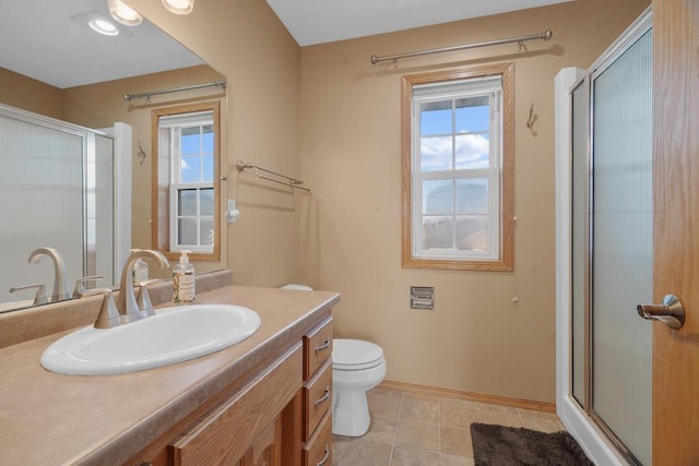 bathroom with toilet, a shower with door, tile patterned floors, and vanity