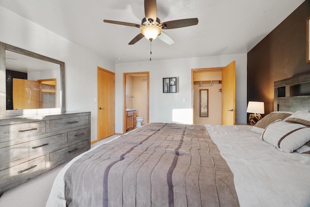 bedroom with ensuite bath and ceiling fan