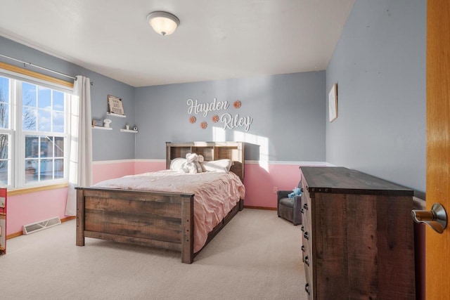 bedroom featuring light carpet