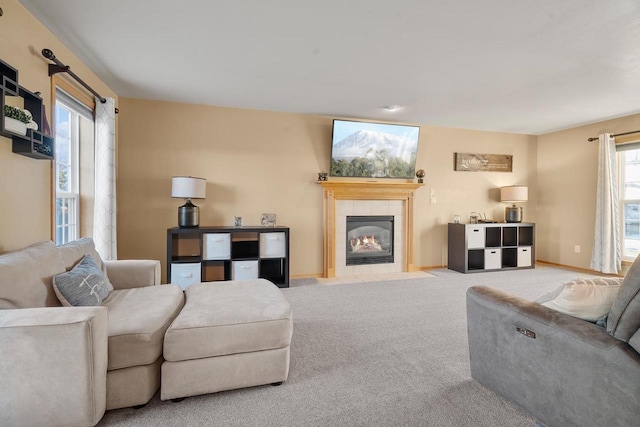 living room featuring a fireplace and light carpet