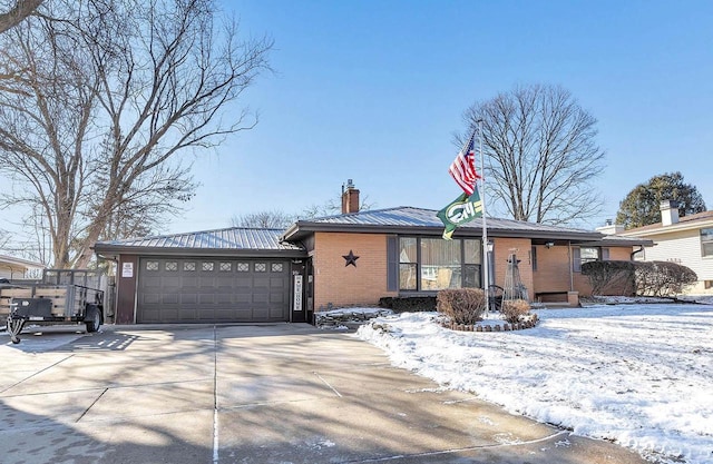 ranch-style home featuring a garage