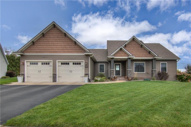 craftsman-style home with a front yard and a garage