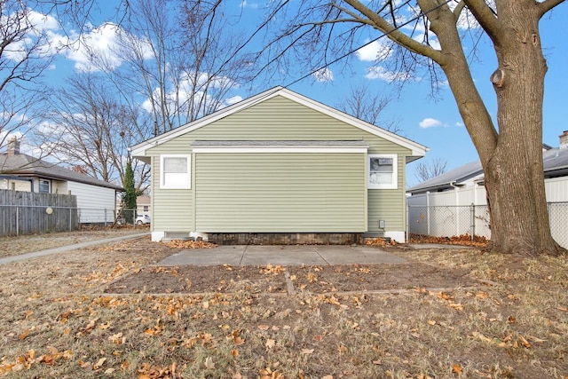 exterior space featuring an outbuilding and a garage